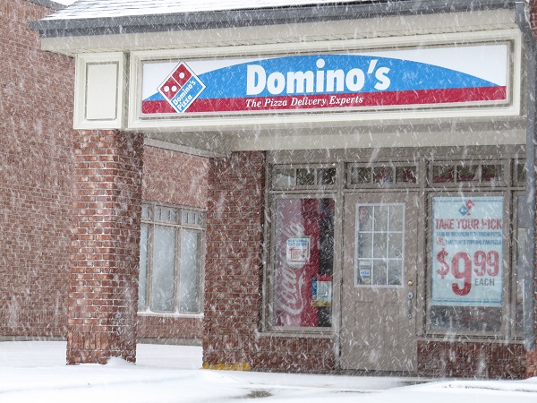 Domino's Pizza store.  The sign says: "Domino's, the pizza delivery experts."